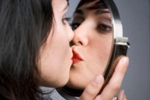woman kissing self